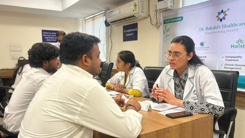 Clinical Psychologist consulting patients at ICSI camp.
