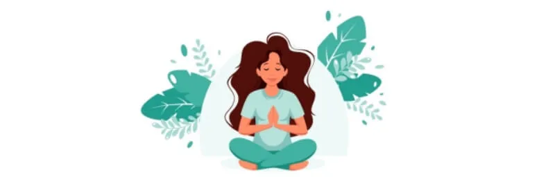 Woman meditating in a lotus pose surrounded by tropical leaves