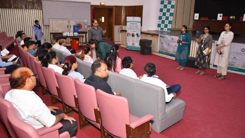 Team addressing audience at CSIR wellness session.