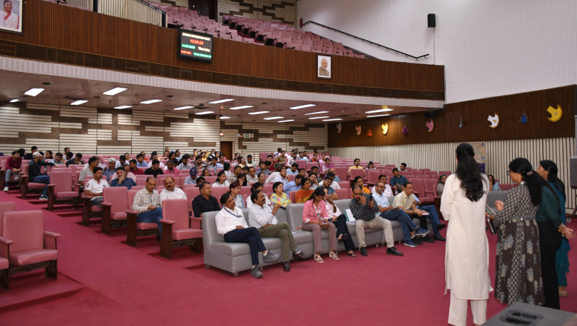 Speaker addressing audience at CSIR wellness session.